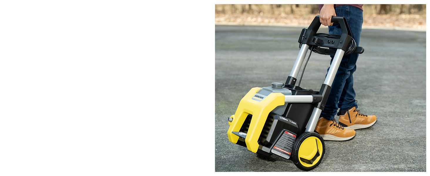 A person pulling the K1700 using the handle and wheels