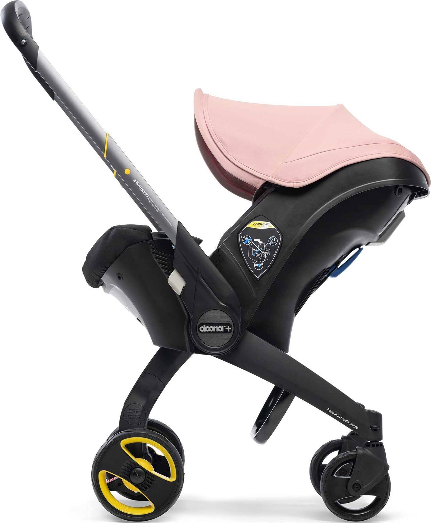 Seggiolino auto per neonati Doona con base rosa cipria
