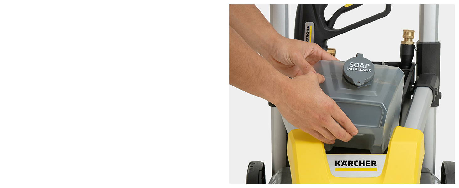 A person removing the detergent tank from the pressure washer