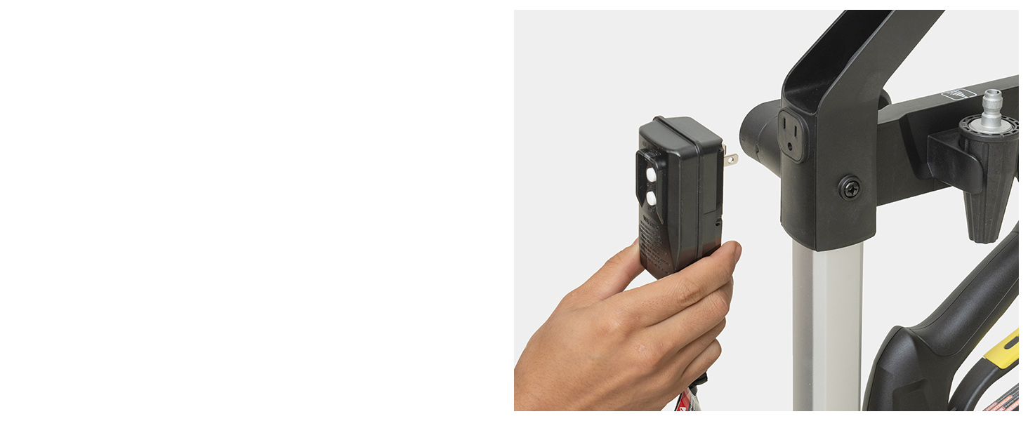 A person placing the power plug in the storage compartment of the K1700