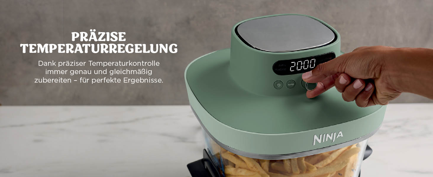 El texto dice „CONTROL PRECISO DE LA TEMPERATURA“. Freidora de aire Ninja verde menta con pantalla digital que muestra „200D“. Control de temperatura ajustable manualmente con patatas fritas visibles en la cesta.