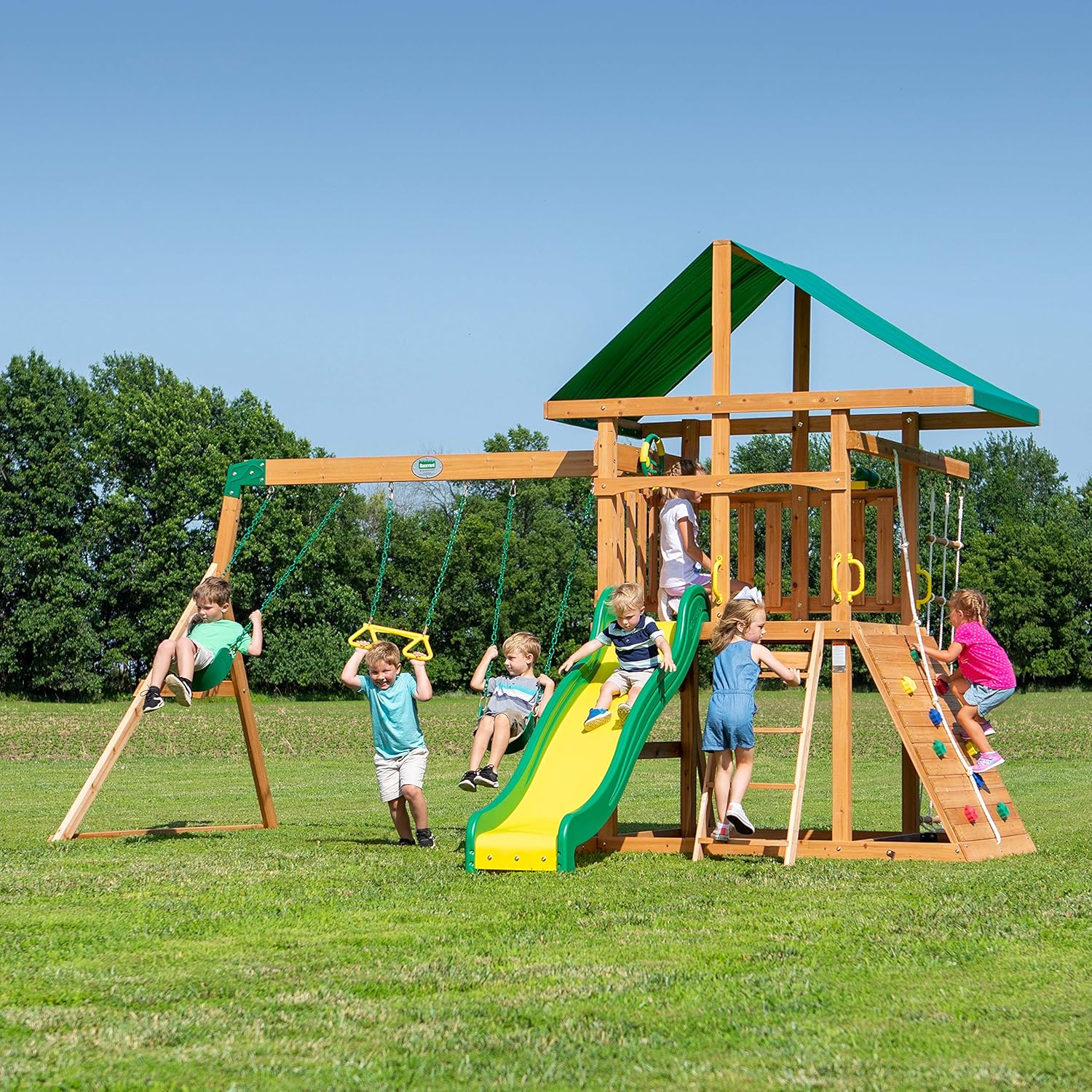 Mount Mckinley Cedar Wood Swing Set with Wave Slide, Play Deck, Double Rock Wall, Rope Ladder, Web Swing, Belt Swings, Toy Telescope, Steering Wheel, Sandbox Area, Outdoor Playset