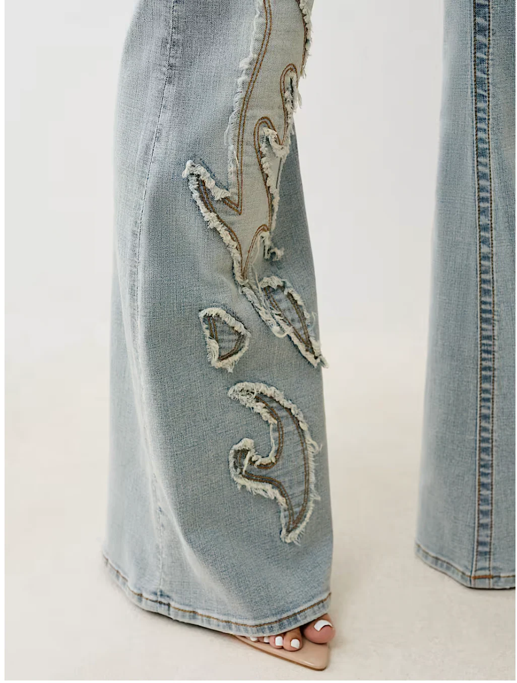 True Religion x Bella Doña - Mid Rise Cut Out Flare Jeans - Light Wash