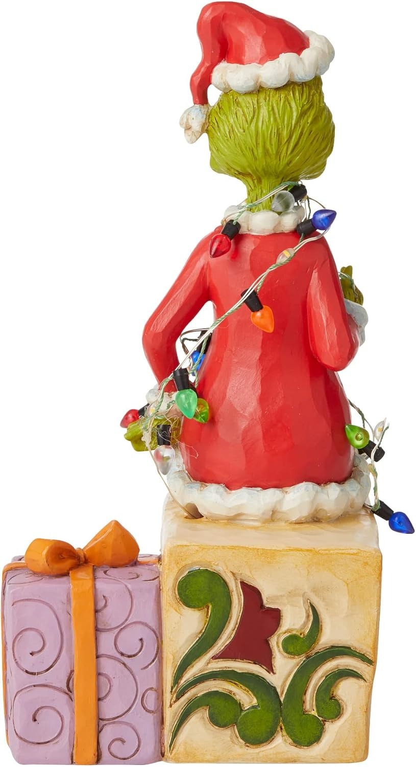 Enesco Jim Shore Dr. Seuss The Grinch seduto sui regali illuminati statuetta, 19 cm, multicolore, rosso