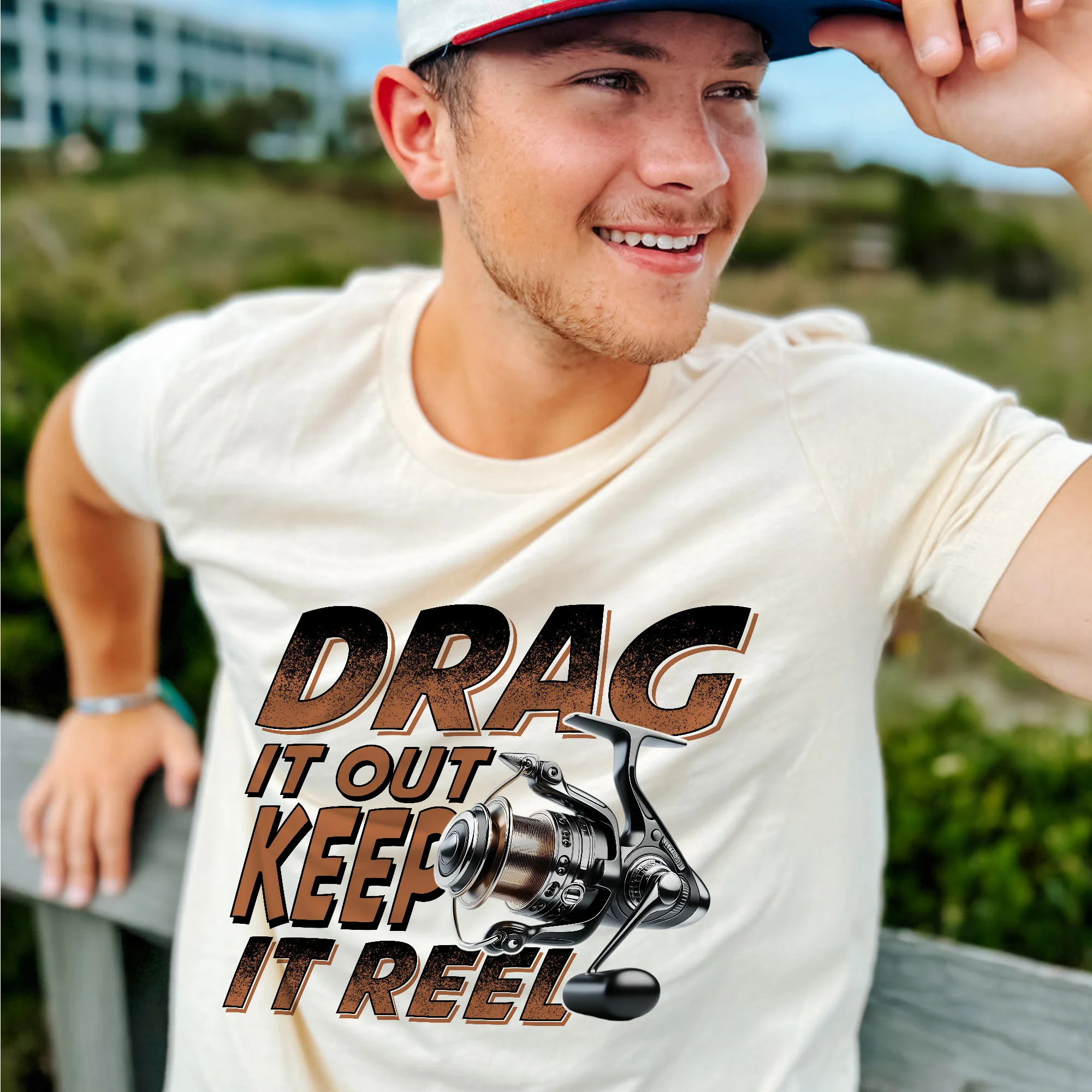 Fishing Pun Shirt �C Drag It Out Keep It Reel Tee �C Funny Angler Gift for Fishermen �C Natural �C Up To 5XL
